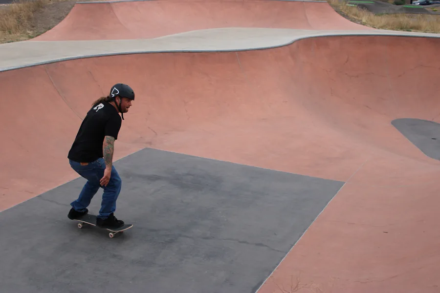 Skater riding a River deck at the park